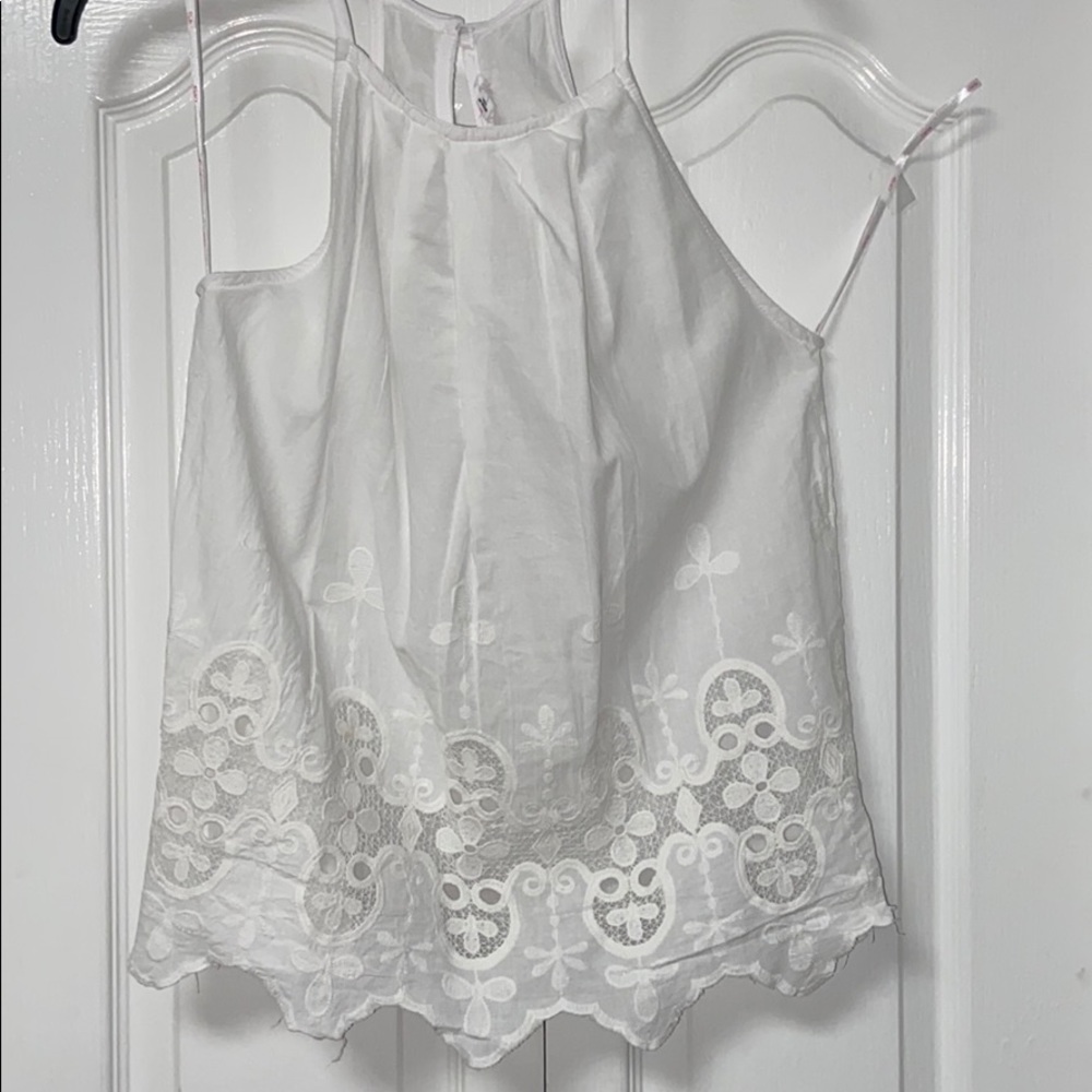 White sleeveless top